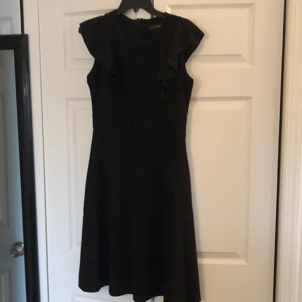 Like new little black dress with ruffles on sleeve
